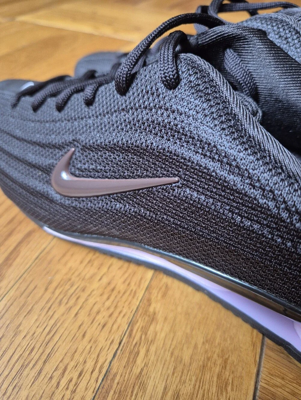 Nike Women’s Black Sneakers with Rose Metallic Swoosh